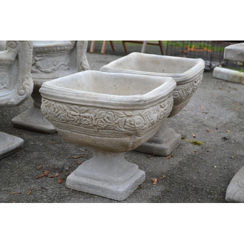 166 - Pair of square urns on stepped base, with rose frieze relief