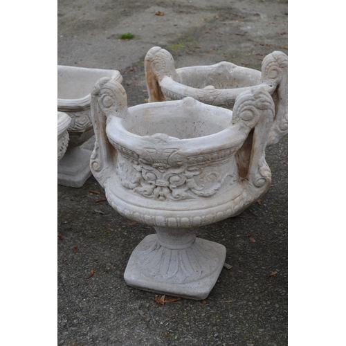 168 - Large handled urn on fluted square base with a chasing floral relief to sides