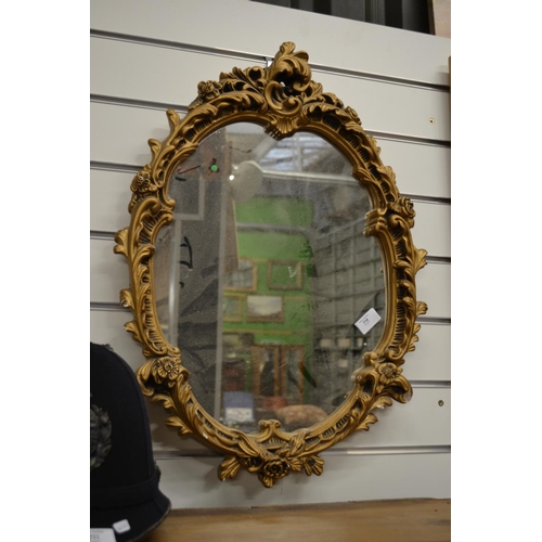 714 - Gilt Framed oval Plaster Mirror