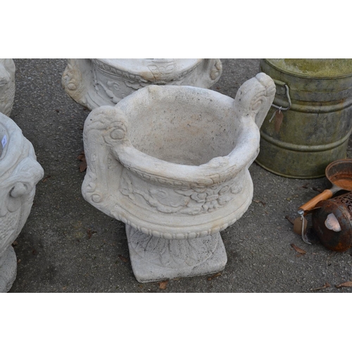 72 - Large handled urn on fluted square base with a chasing floral relief to sides