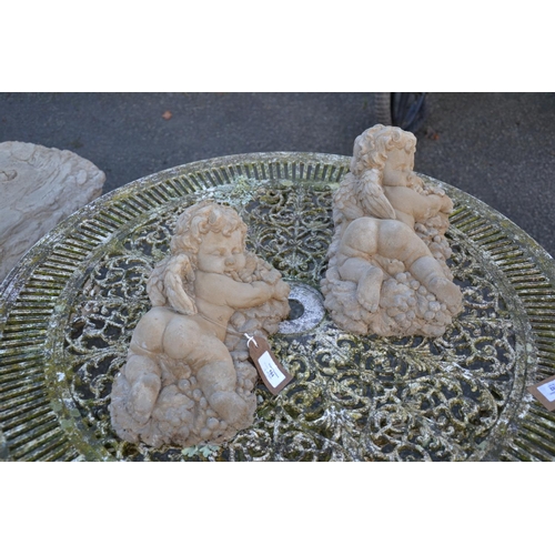 101 - Pair of concrete cherubs on grape beds