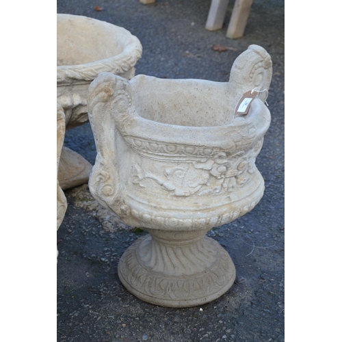 92 - Concrete 2 handled urn, with chasing floral design to exterior