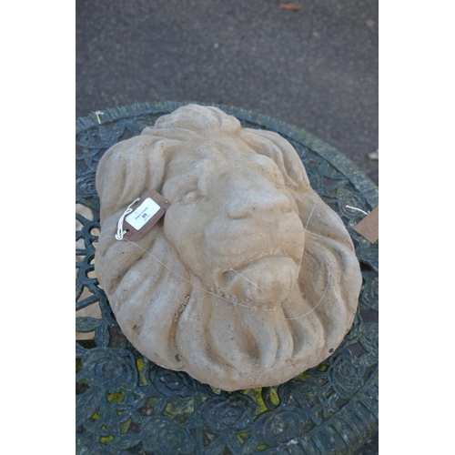 98 - Concrete wall hanging lions mask