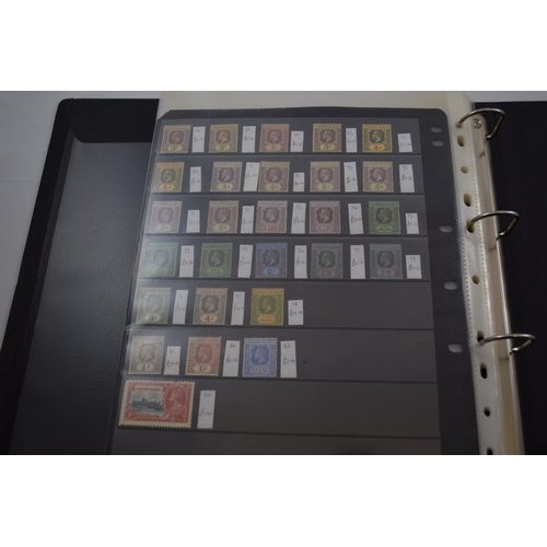 398 - GB Commonwealth stamps, Dominica to Leeward Islands stock book of mint QV to KGV