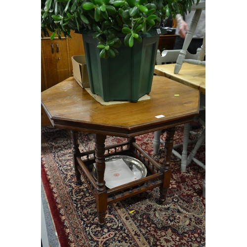 719 - Octagonal 2 tiered table with galleried leather section