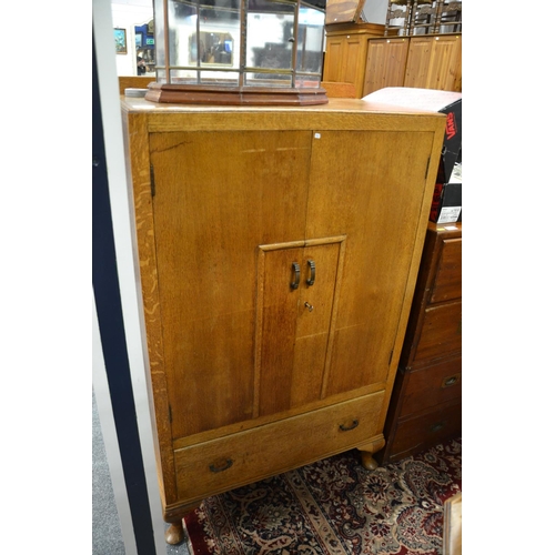 724 - Art Deco oak cupboard with drawer to base. w 74cm x d 41xm x 125cm