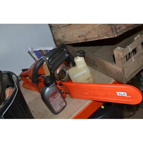 34a - Husqvarna petrol chainsaw with accessories.  Used once.