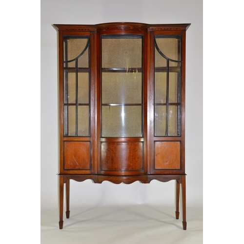 107 - Edwardian glass front & sided cabinet, with impressive bowed glass front, on arrow feet. 172cm high ... 