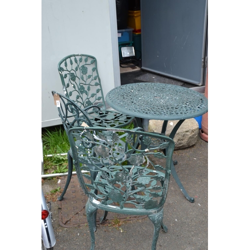 216 - Cast aluminium bistro table with 3 mis- matched chairs