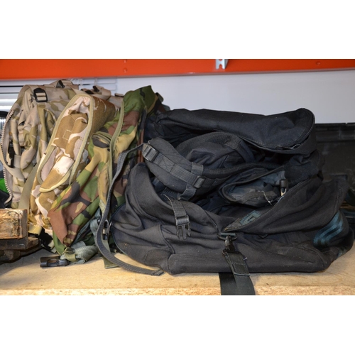 50 - quantity of military issue backpacks, bags etc.