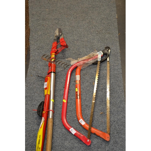 31 - Wolf Garten long handled loppers, rake + 2 bow saws