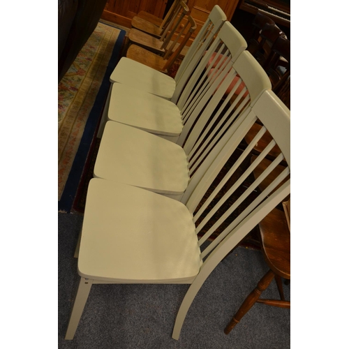 714 - Set of four green painted stick back chairs