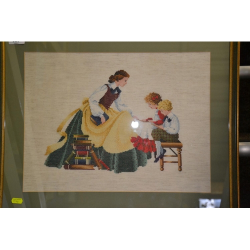 259 - Framed tapestry of a family scene, overall width 59cm