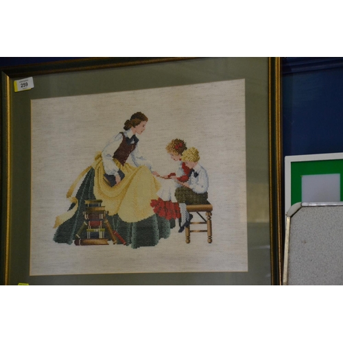 259 - Framed tapestry of a family scene, overall width 59cm