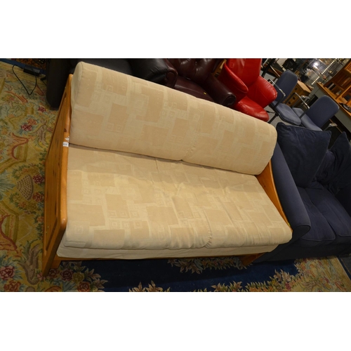 826 - Pine framed double futon with cream upholstery