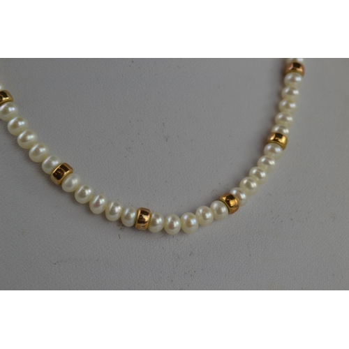 368 - String of pearls with 9ct clasp & yellow metal spacers testing positive for gold