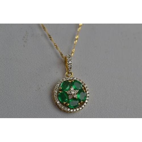 380 - 18ct gold, emerald & diamond pendant  & chain