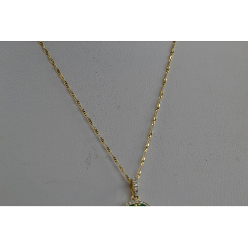 380 - 18ct gold, emerald & diamond pendant  & chain