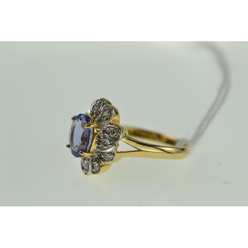 383 - 18ct gold, tanzanite & diamond cluster ring, size O