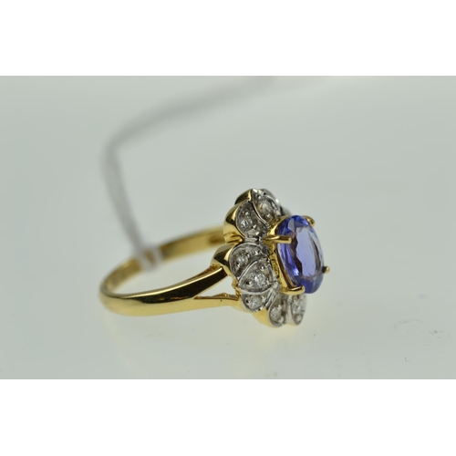 383 - 18ct gold, tanzanite & diamond cluster ring, size O