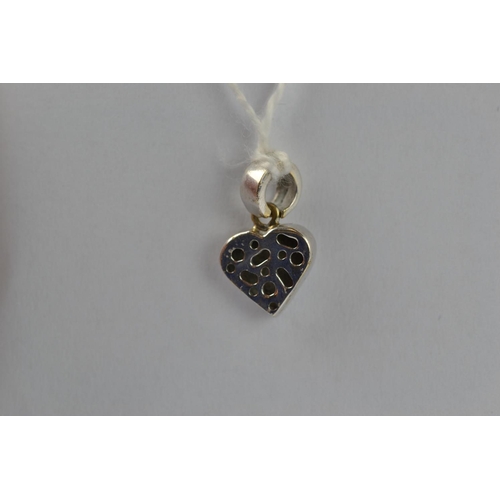 391 - 9ct white gold & diamond heart pendant