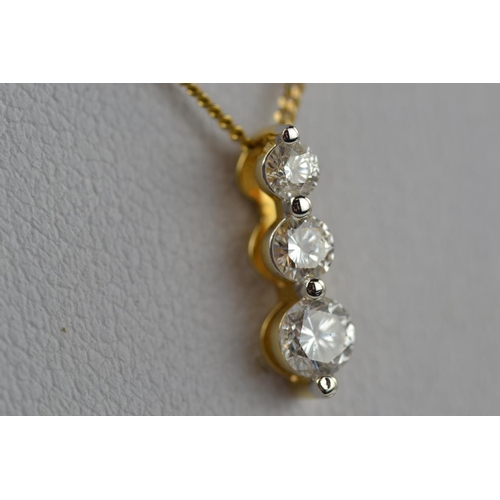 392 - 18ct gold & three stone diamond pendant (0.50 carat) & 9ct gold chain