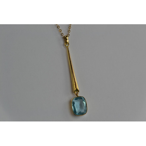 394 - 9ct gold & blue stone pendant & chain