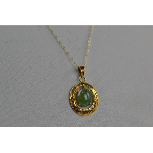 408 - 14ct gold & jade pendant & 9ct gold chain