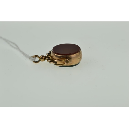 413 - 9ct gold & hardstone swing fob