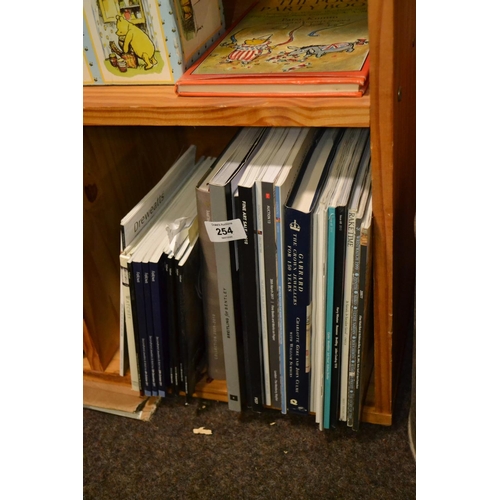 254 - Shelf of watch reference books & auction catalogues, along with other books inc. Garrards