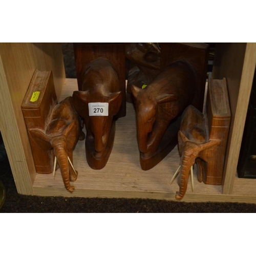 270 - 2 pairs of carved wood elephant book ends and a carved eagle figure.