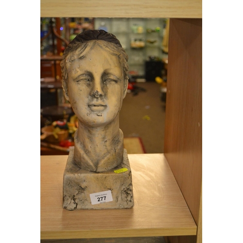 277 - Painted terracotta head of a girl