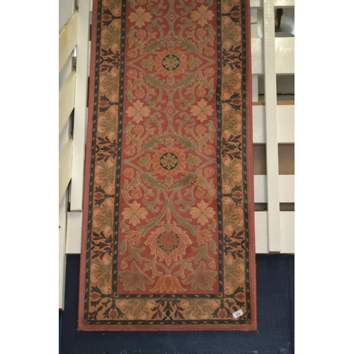 478 - Floral runner rug. Width 69 CM. Length 2.1M