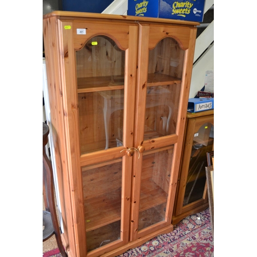 491 - Pine 2 door glass fronted display cabinet. Width 79 CM. Height 152 CM.