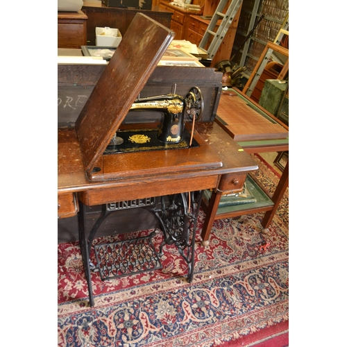 497 - Singer sewing machine on treadle base