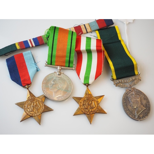 239 - WWII group of medals including Territorial medal inscribed '2057852 GNR V. Valpy R.A' & ribbons, wit... 