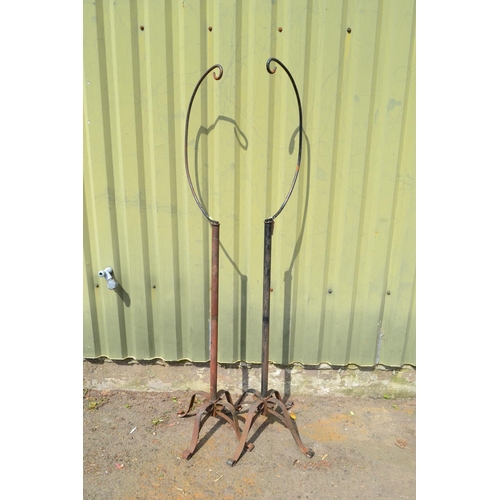 18 - Two wrought iron free standing hanging baskets, 173cm high