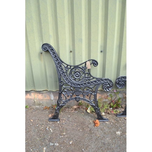 34 - Pair of black painted cast metal bench ends