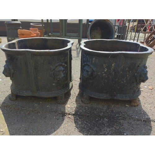 9 - Pair of Victorian clover leaf cast iron garden urn planters. With lions head detail to corners and r... 