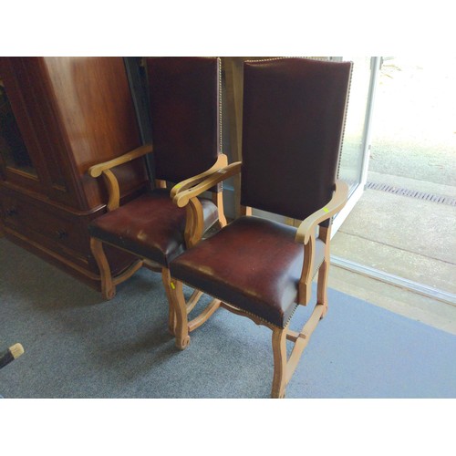 579 - Beech framed Leather upright carver chairs x 2