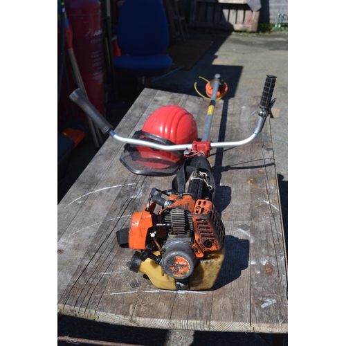 134 - Husqvarna petrol strimmer with safety helmet. No safety guard to strimmer and stop button may need i... 