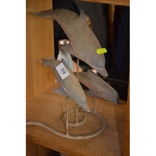 316 - Mounted wooden dolphins.