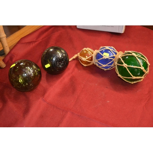 357 - 3 strung colourful glass fishing floats, with 2 loose. H13cm (largest). All good condition.