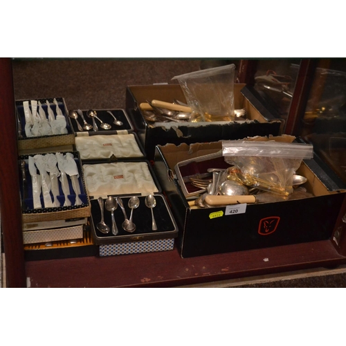 420 - Large qty of mostly silver plated flatware (contents of bottom shelf)