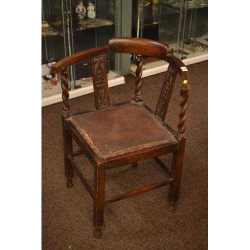 441 - Oak carved corner chair, seat needs reupholstering