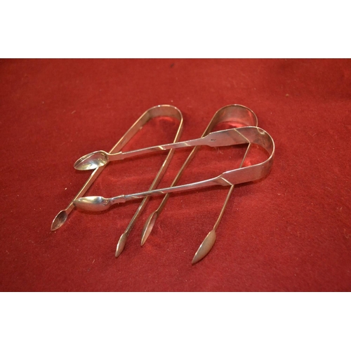 476 - Three HM silver sugar tongs including one Exeter, gross weight 91.05 grams