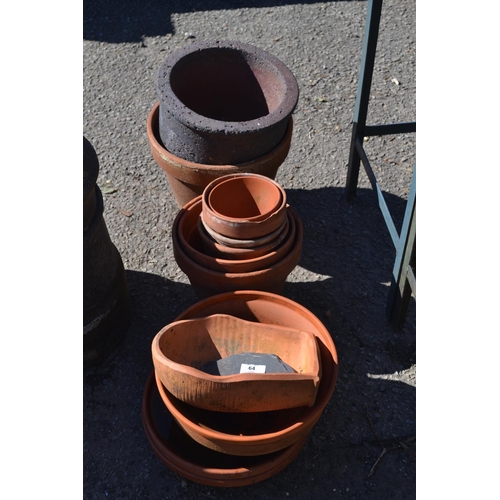 64 - Various terracotta etc. planters & saucers