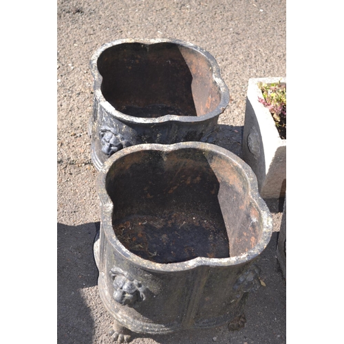 9 - Pair of Victorian clover leaf cast iron garden urn planters. With lions head detail to corners and r... 
