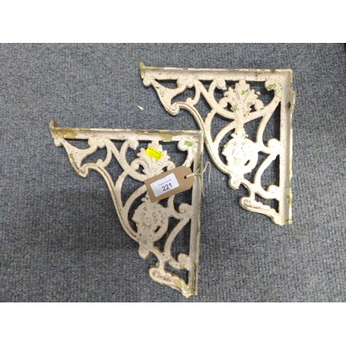 221 - Pair of ornate cast iron wall brackets.