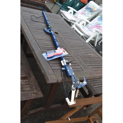 105 - Long handled pruner with blade sharpener.